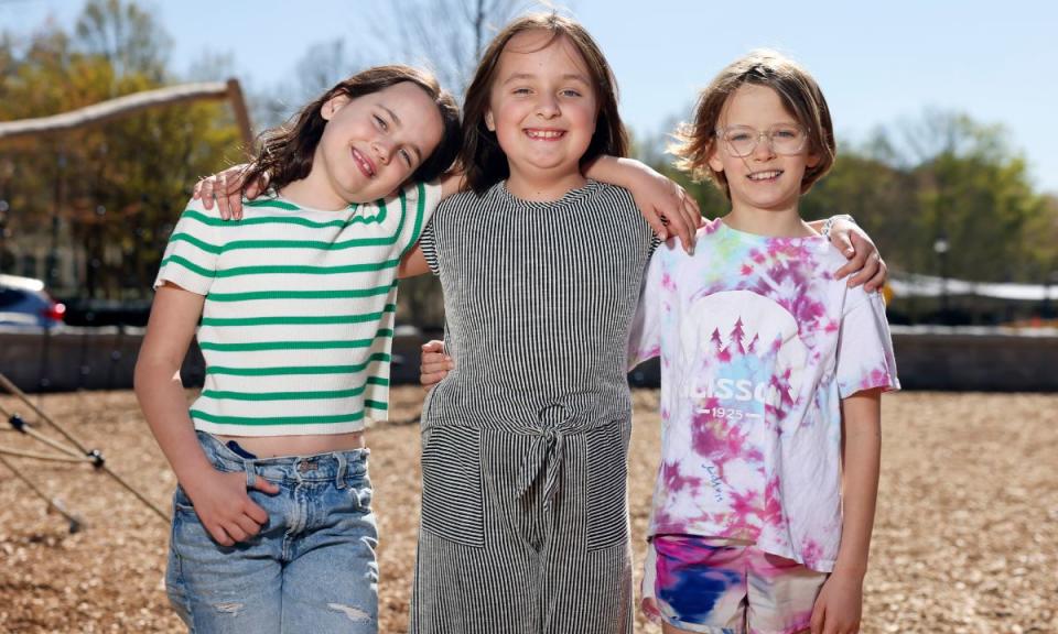 Third graders Berkley Carter (from left), June Simmons and Daphne Murray, from Smyrna Elementary, pose for a photograph at the playground at the Smyrna Community Center, Thursday, March 28, 2024, in Smyrna. These students, also known as the Recess Rangers, went in front of the Cobb County school board to ask for more recess time. (Jason Getz/The Atlanta Journal-Constitution)