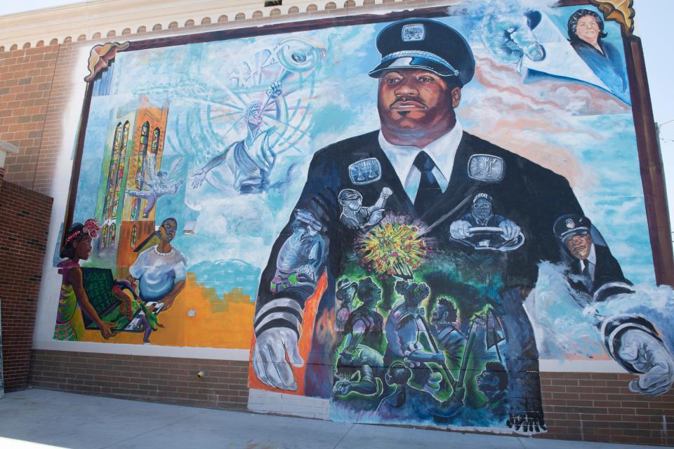 A mural memorializing Detroit victims of the COVID-19 pandemic was unveiled at the fire station on Seven Mile Road near John R Road in Detroit on Sunday.