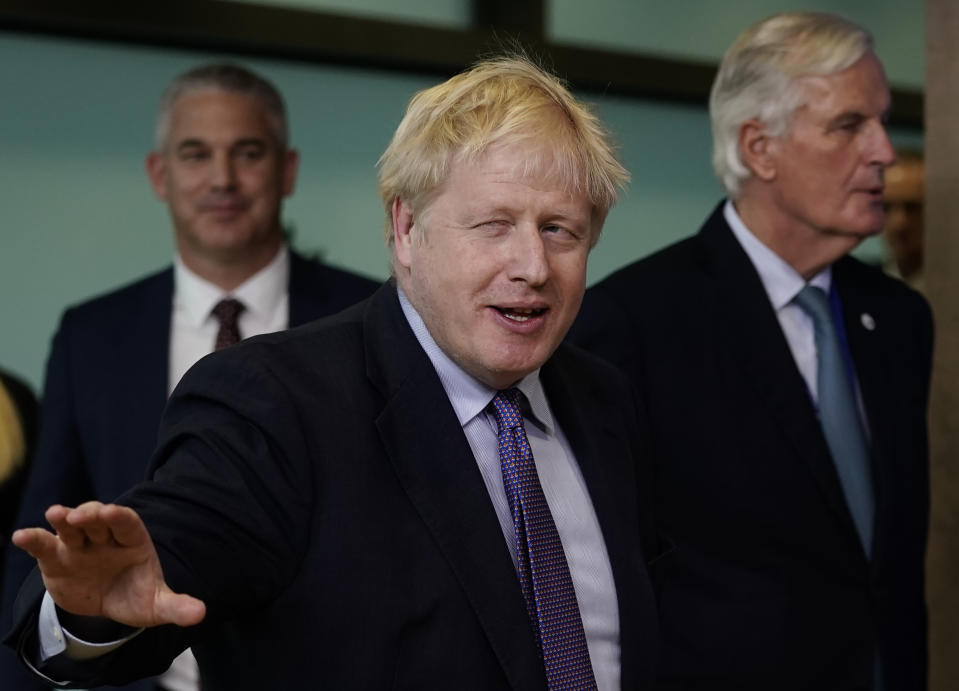 British Prime Minister Boris Johnson (C) gestures as he walks with EU chief Brexit negotiator Michel Barnier (R) as they prepare to address a press conference at a European Union Summit at European Union Headquarters in Brussels on October 17, 2019. (Photo by Kenzo TRIBOUILLARD / AFP) (Photo by KENZO TRIBOUILLARD/AFP via Getty Images)