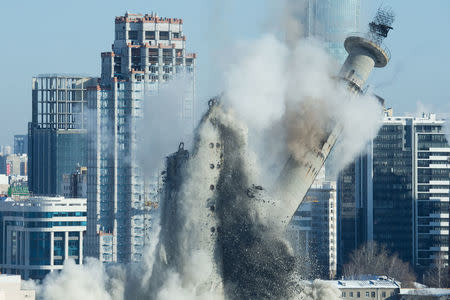 The unfinished and abandoned TV tower collapses during a controlled demolition in Yekaterinburg, Russia March 24, 2018. REUTERS/Alexei Kolchin