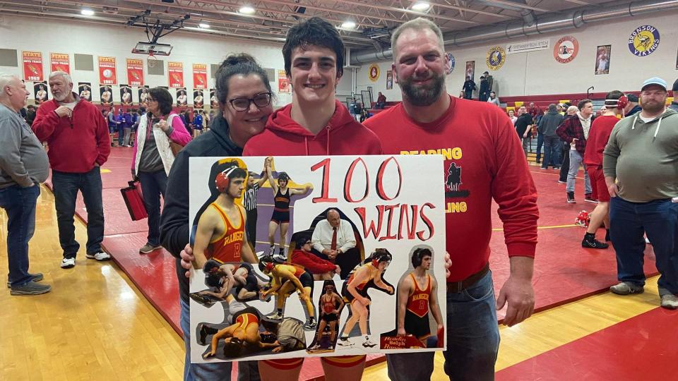 Senior Lukas Selph (with his parents) won his 100th career victory against Springport during his final season with the Rangers.