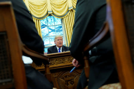 U.S. President Donald Trump sits for an exclusive interview with Reuters journalists in the Oval Office at the White House in Washington, U.S. December 11, 2018. REUTERS/Jonathan Ernst