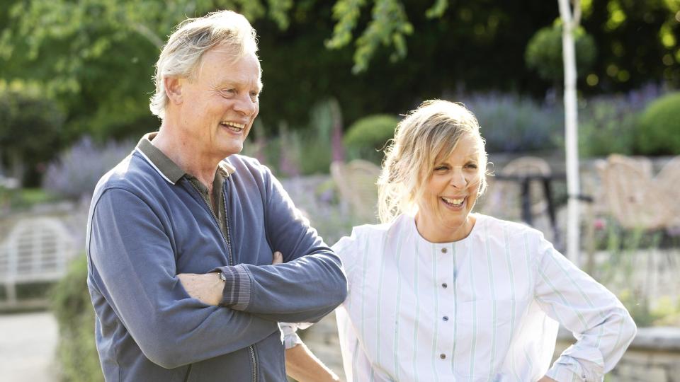 Martin Clunes in a dark shirt and Mel Giedroyc in a light top in Mel Giedroyc and Martin Clunes Explore Britain by the Book.