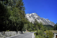 The Planpincieux glacier, located in the Alps on the Grande Jorasses peak of the Mont Blanc massif, is seen from Val Ferret, a popular hiking area on the south side of the Mont Blanc, near Courmayeur, northern Italy, Friday, Aug. 7, 2020. Some 70 people were evacuated Thursday in the valley below the glacier and roads closed after the threat of collapse the the fast-moving melting glacier is posing to the picturesque valley near the Alpine town of Courmayeur. (Claudio Furlan/LaPresse via AP)