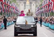 <p>Waving to crowds from the Mall to mark the Queen's 90th birthday celebrations.</p>