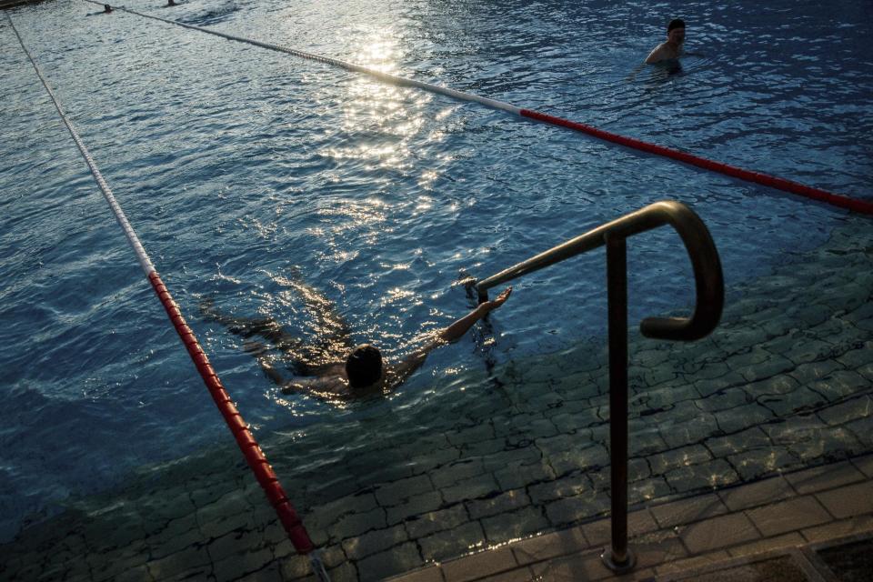 Health authorities advise swimmers to keep their mouths shut and avoid swallowing pool water to prevent swallowing bacteria. Source: AP, file