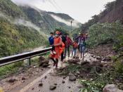 This photograph provided by India’s National Disaster Response Force (NDRF) shows NDRF personnel rescuing civilians stranded following heavy rains at Chhara village near Nainital, Uttarakhand, Wednesday, Oct. 20, 2021. Nainital remained cut off from the rest of the state as roads leading to it were either blocked by landslides or washed away. ( National Disaster Response Force via AP)