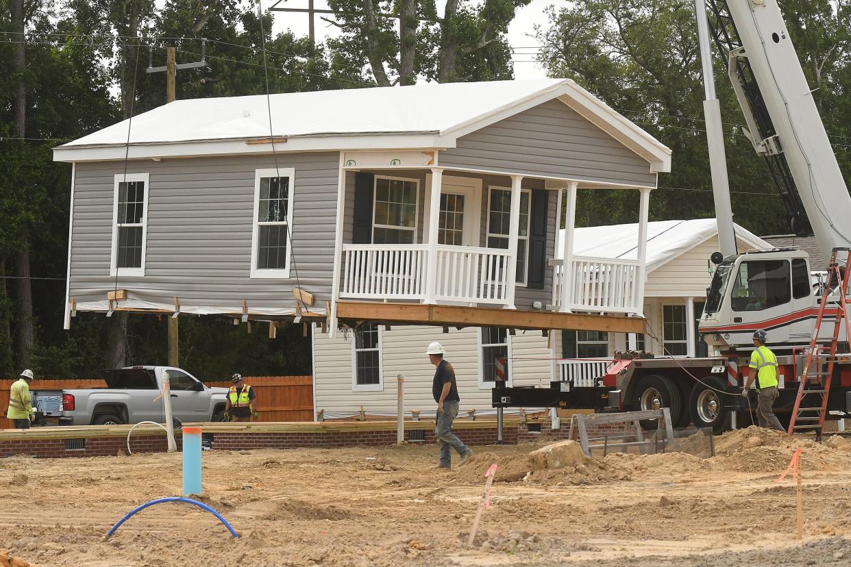 Another home is put into place at Eden Village Tuesday May 24, 2022 off Kornegay Avenue in Wilmington, N.C.