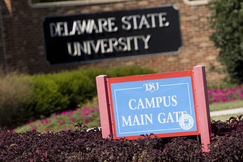<p>Jay Premack/Bloomberg via Getty Images</p> A stock image of the main gate of the Delaware State University campus.