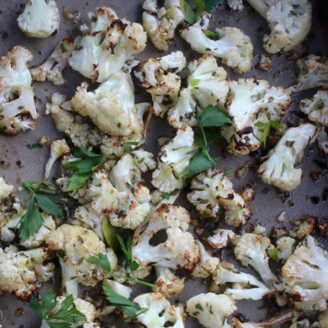 <p>If you need a break from all the taters and stuffing, toss some cauliflower with cloves and lemon for a lighter side that won't leave you feeling bogged down.</p><p><strong>Get the recipe at <a rel="nofollow noopener" href="http://www.beyondthebite4life.com/2015/10/tuscan-roasted-cauliflower-aippaleo-keto.html" target="_blank" data-ylk="slk:Beyond the Bite 4 Life;elm:context_link;itc:0;sec:content-canvas" class="link ">Beyond the Bite 4 Life</a>. </strong></p>