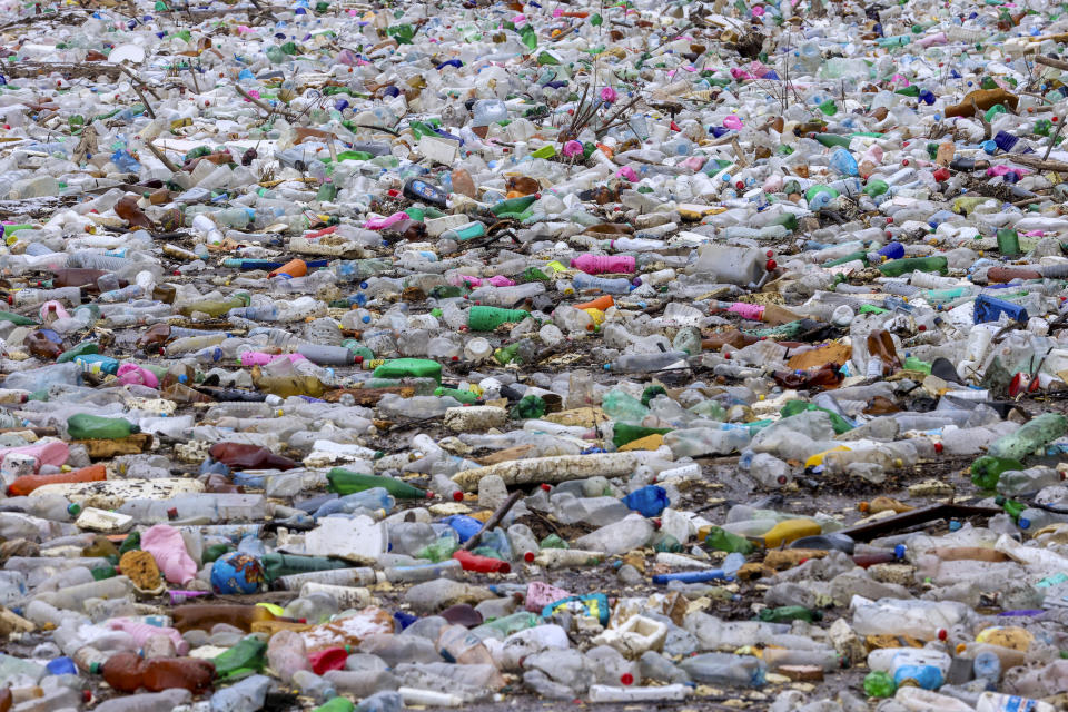 Waste float in the Drina river near Visegrad, Bosnia, Wednesday, Jan. 10, 2024. Tons of waste dumped in poorly regulated riverside landfills or directly into the rivers across three Western Balkan countries end up accumulating during high water season in winter and spring, behind a trash barrier in the Drina River in eastern Bosnia. (AP Photo/Armin Durgut)