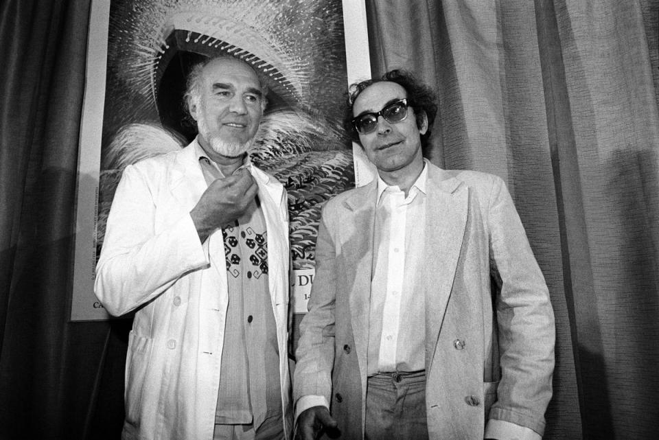 Jean-Luc Godard (R) pictured with French actor Michel Piccoli (L) at the Cannes Film Festival in 1982 (AFP via Getty Images)