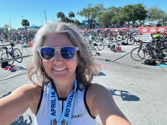 Executive Editor Mara Bellaby, exhausted but thrilled after completing the 2024 Cocoa Beach Triathlon.