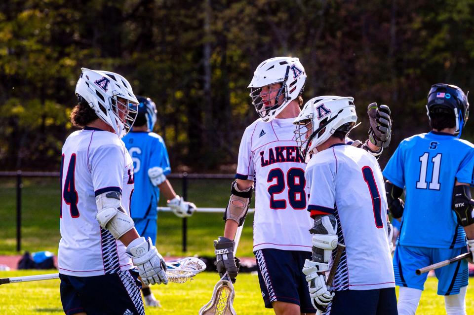 The Lakers come in to celebrate Harrison Lemieux (1) goal.  Lemieux finished with two goals.