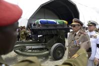 The coffin of former South African President Nelson Mandela leaves the makeshift tent for a traditional burial in Qunu December 15, 2013. REUTERS/Odd Andersen/Pool (SOUTH AFRICA - Tags: SOCIETY OBITUARY POLITICS)