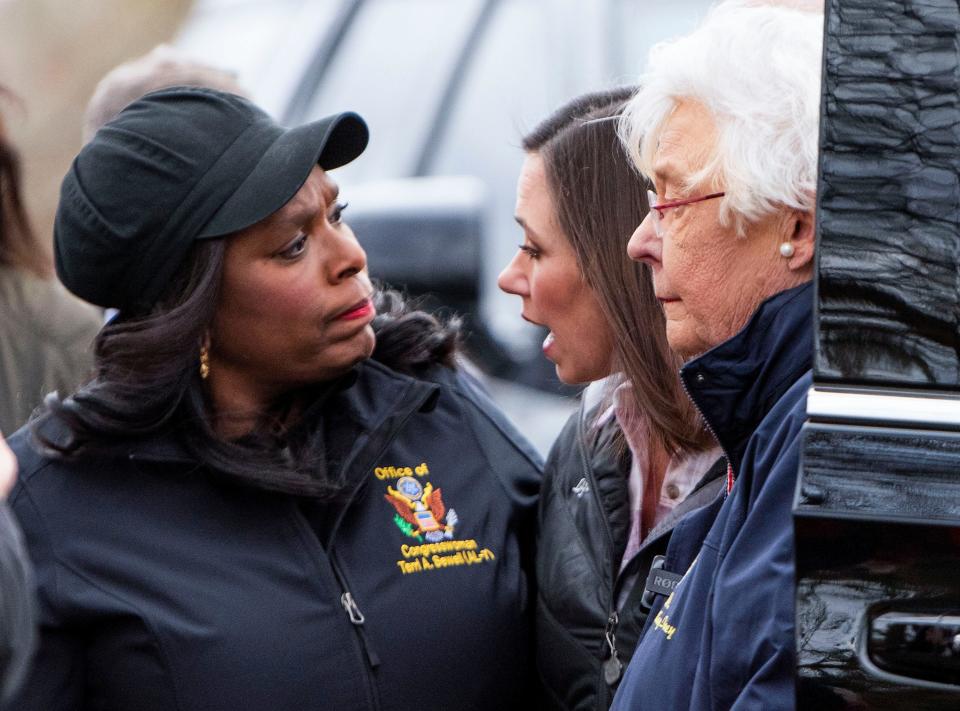 U.S. Rep. Terri Sewell, from left, U.S. Sen. Katie Britt and Alabama Gov, Kay Ivey talk as they survey storm damage in Selma, Alabama, on Jan. 13, 2023, a day after a tornado ripped through the city.