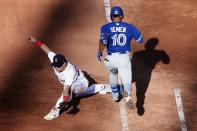 Boston Red Sox's Bobby Dalbec, left, makes the play at first base after Toronto Blue Jays' Marcus Semien (10) grounded into a double play during the sixth inning of a baseball game, Saturday, June 12, 2021, in Boston. (AP Photo/Michael Dwyer)