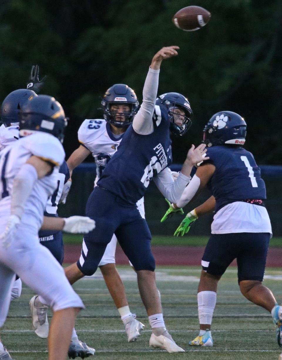 Pittsford quarterback Caleb Lewis (16) throws downfield as Victor defense starts to pressure from all sides during their Section V matchup Friday, Sept. 16, 2022 at Pittsford Sutherland High School. 