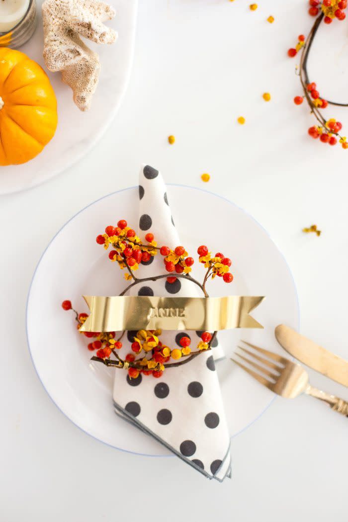 <p>Wow your guests with beautiful DIY gold ribbon stamped place cards, which you can then set in red and gold bittersweet vine wreaths. </p><p><strong><em><a href="https://www.flaxandtwine.com/2015/11/diy-gold-ribbon-stamped-place-cards/" rel="nofollow noopener" target="_blank" data-ylk="slk:Get the tutorial at Flax & Twine;elm:context_link;itc:0;sec:content-canvas" class="link ">Get the tutorial at Flax & Twine</a>. </em></strong></p><p><a class="link " href="https://www.amazon.com/QueenLeather-Stamping-Alphabet-Lowercase-Imprinting/dp/B09B1935R6?tag=syn-yahoo-20&ascsubtag=%5Bartid%7C10070.g.2668%5Bsrc%7Cyahoo-us" rel="nofollow noopener" target="_blank" data-ylk="slk:SHOP METAL STAMP SET;elm:context_link;itc:0;sec:content-canvas">SHOP METAL STAMP SET</a></p>