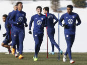 U.S. men's national team forward Christian Pulisic, center, practices with teammates in Columbus, Ohio, Wednesday, Jan. 26, 2022, ahead of Thursday's World Cup qualifying match against El Salvador. (AP Photo/Paul Vernon)