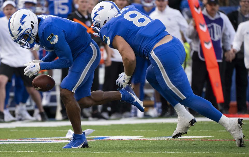 Air Force defensive back Jamari Bellamy, left, and linebacker Bo Richter (8) jump on a Utah State fumble during the first half of an NCAA college football game in Air Force Academy, Colo., Friday, Sept. 15, 2023. | Christian Murdock/The Gazette via AP