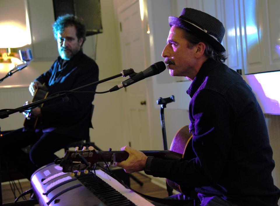 Robert A. Kraft, left, director of the Bastrop Live Music Foundation, performs with guest Zak Schaffer at a recent Bastrop Songwriters Showcase at Heritage Hall in Bastrop.