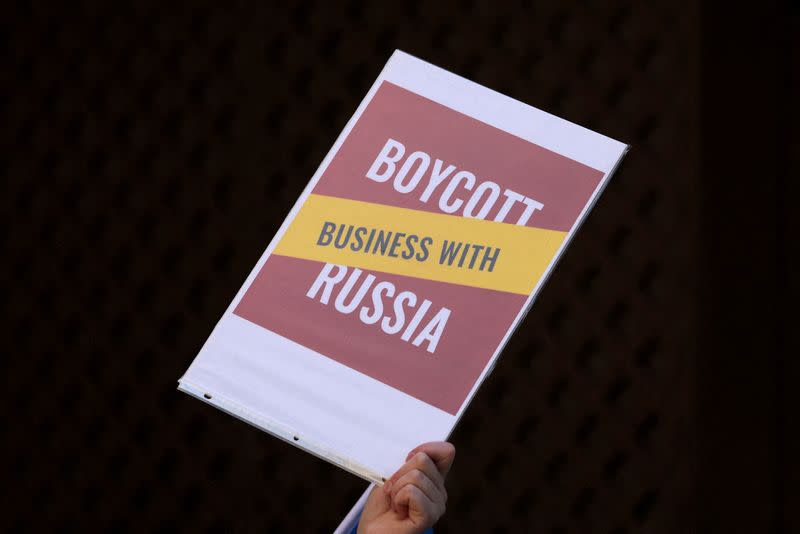 FILE PHOTO: Demonstration by supporters of Ukraine against Philip Morris International Inc continued business in Russia during protest in Manhattan, New York City