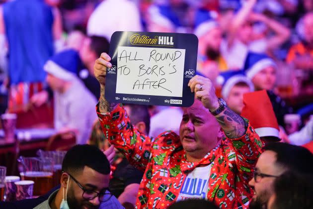 <strong>Fan holding a sign mentioning Boris Johnson during the World Darts Championship at Alexandra Palace, London on Monday.</strong> (Photo: Zac Goodwin via PA Wire/PA Images)