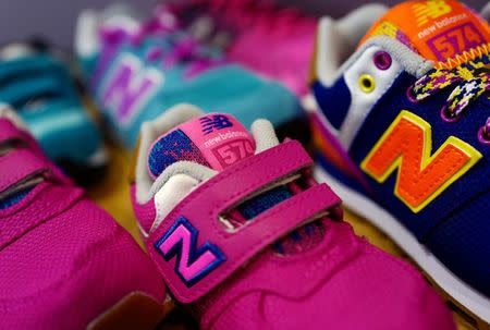 Sneakers for children of U.S. manufacturer New Balance are on display at a children clothing shop in Hanau near Frankfurt, Germany, March 18, 2016. REUTERS/Kai Pfaffenbach/File Photo