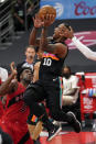 San Antonio Spurs forward DeMar DeRozan (10) shoots over Toronto Raptors forward OG Anunoby (3) during the first half of an NBA basketball game Wednesday, April 14, 2021, in Tampa, Fla. (AP Photo/Chris O'Meara)