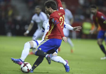 Football Soccer - Spain v Israel - 2018 World Cup Qualifying European Zone - Group G - El Molinon Stadium, Gijon, Spain, 24/3/17 Spain's David Silva shots to score first goal. REUTERS/Eloy Alonso