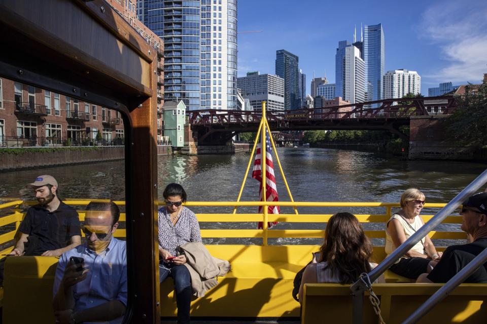 FILE - In this June 18, 2019, file photo commuters ride a water taxi up the Chicago River to Michigan Avenue. The shareholder comes first has for years been the mantra of the Business Roundtable, a group representing the most powerful CEOs in America. The group on Monday, Aug. 19, released a new mission statement that implies a foundational shift; a step back from shareholder primacy. (AP Photo/Amr Alfiky, File)