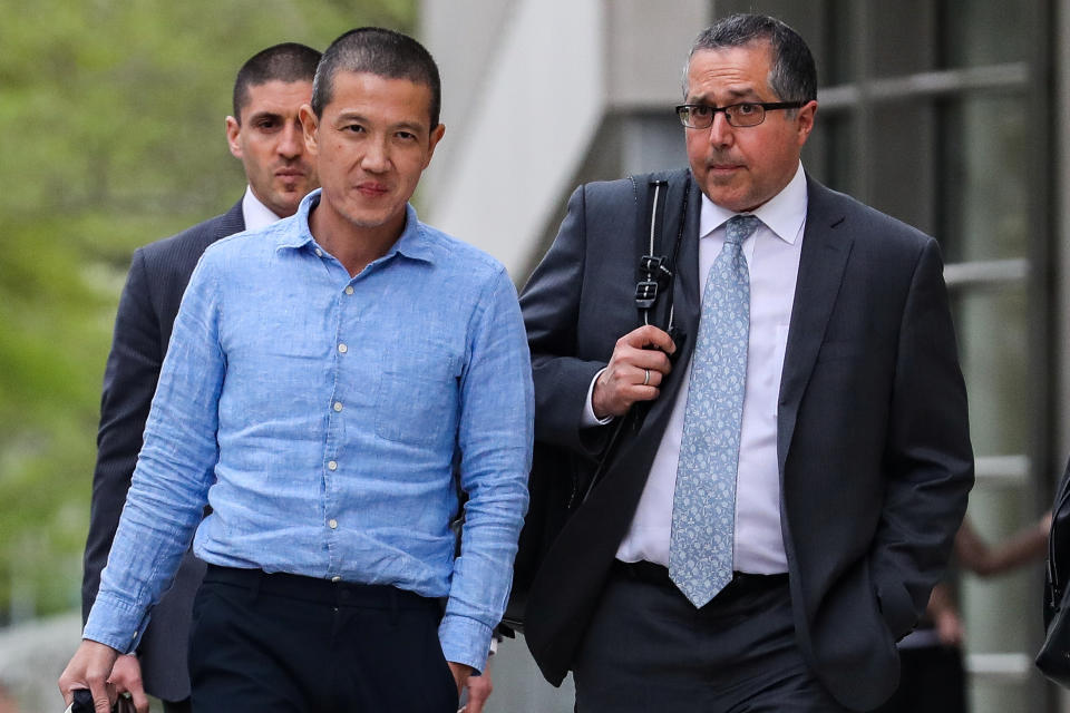 Ex-Goldman Sachs banker Roger Ng and his lawyer Marc Agnifilo leave the federal court in New York, U.S., May 6, 2019. REUTERS/Jeenah Moon