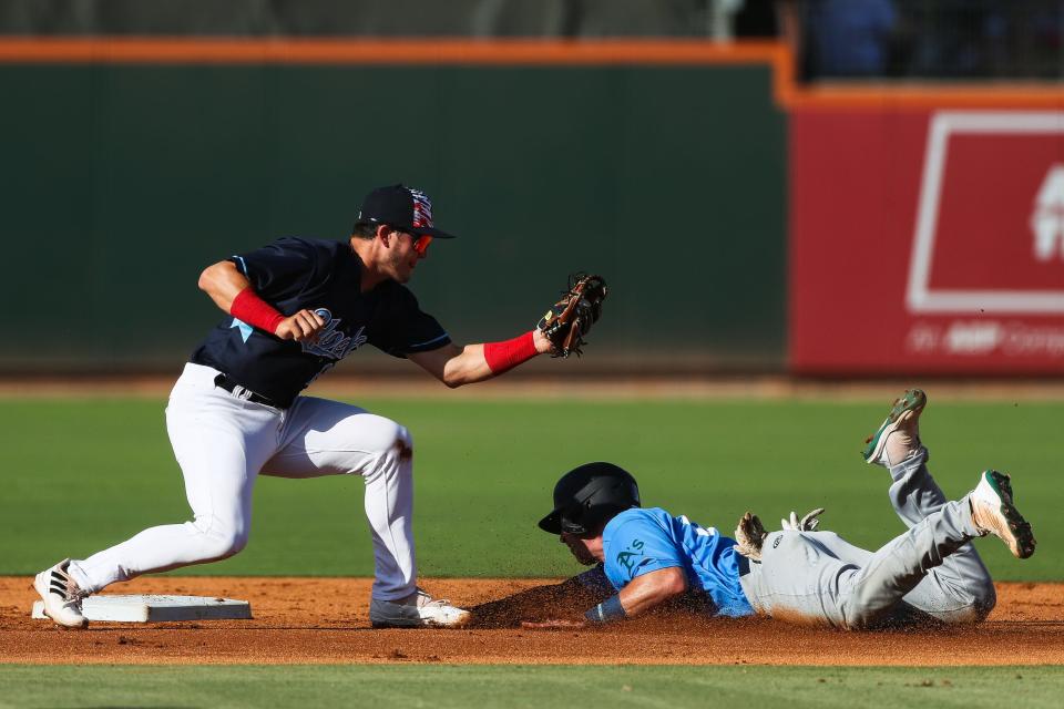 Hooks infielder Will Wagner (16) tags out a runner at second base in a game against Midland on Monday, July 4, 2022 at Whataburger Field in Corpus Christi, Texas.
