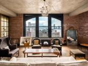 <p>It has wide-planked custom wooden floors, a media room, concrete ceilings and exposed brick walls. Source: Streeteasy via Douglas Elliman </p>