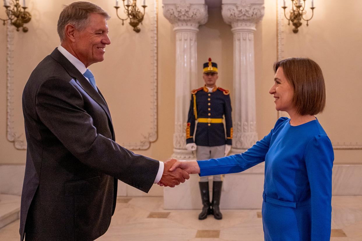 Romania's President Klaus Iohannis, left, shakes hands with Moldova's President Maia Sandu (Copyright 2023 The Associated Press. All rights reserved)