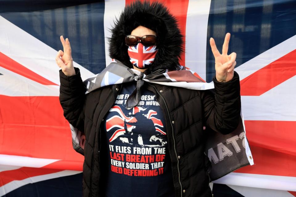 A supporter of Dennis Hutchings waits for his arrival at court (Peter Morrison/PA) (PA Wire)