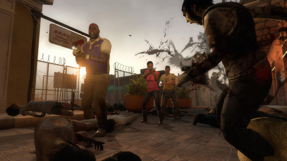 Three characters shoot at zombies in Left 4 Dead 2