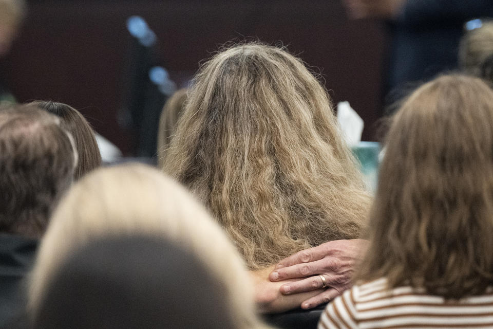 Family of Anna Moriah Wilson embraces in the courtroom during the sentencing portion of Kaitlin Armstrong's murder trial at the Blackwell-Thurman Criminal Justice Center on Friday, Nov. 17, 2023 in Austin, Texas. Prosecutors are seeking a prison sentence of at least 40 years for Armstrong convicted of murder in the shooting death of rising professional cyclist Anna Moriah Wilson. (Mikala Compton/Austin American-Statesman via AP, Pool)