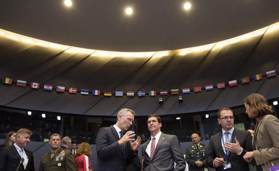 NATO Secretary General Jens Stoltenberg, left, and acting U.S. Secretary for Defense Mark Esper chair a meeting of the coalition to defeat Islamic State militants at NATO headquarters in Brussels, Thursday, June 27, 2019. (AP Photo/Virginia Mayo, Pool)