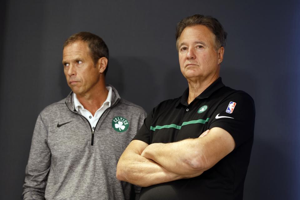 Boston Celtics basketball co-owner Stephen Pagliuca, right, and team president Rich Gotham listen during a news conference, Friday, Sept. 23, 2022, in Boston. The Celtics suspended coach Ime Udoka for the upcoming season after a months-long investigation by an external law firm that found multiple violations of team policies. (AP Photo/Michael Dwyer)