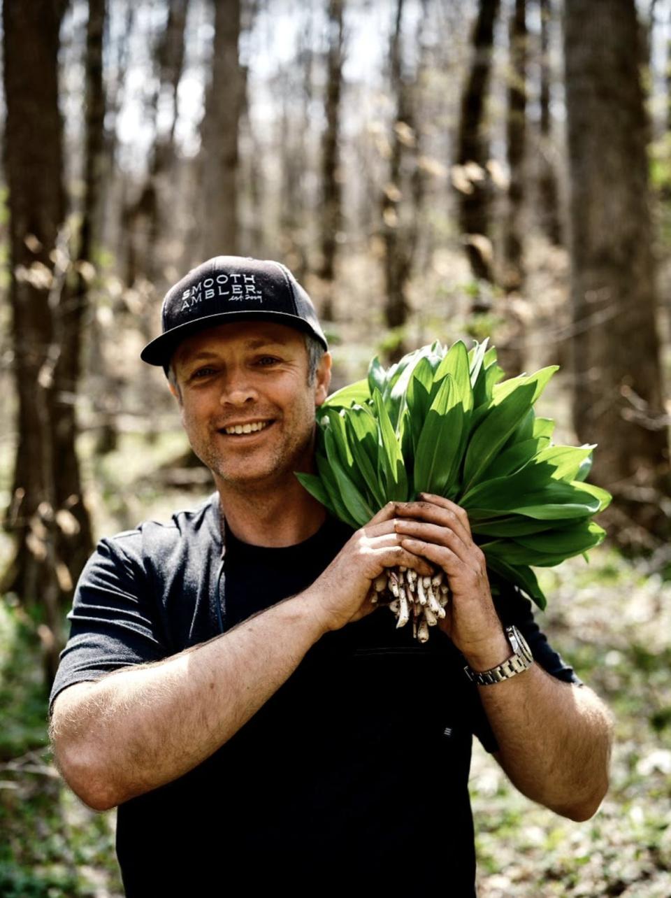 Chef William Dissen foraging for ramps in the Appalachian Mountains.