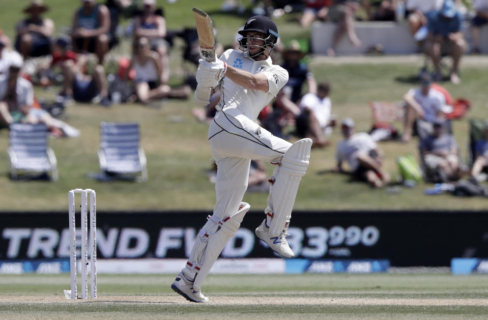 New Zealand's Mitchell Santner bats during play on day four of the first cricket test between England and New Zealand at Bay Oval in Mount Maunganui, New Zealand, Sunday, Nov. 24, 2019. (AP Photo/Mark Baker)