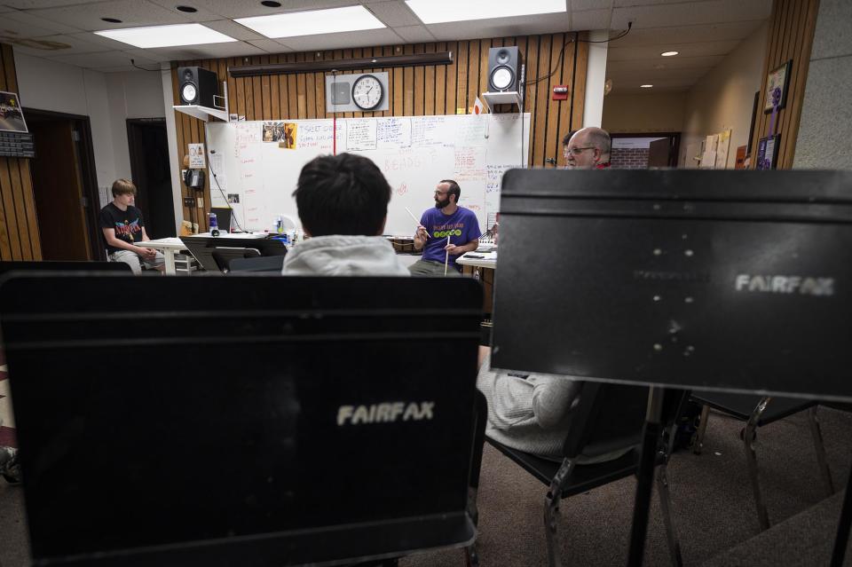 Glen Wallace, a music teacher at BFA-Fairfax, center, seen on April 18, is looking forward to improvements to the band room. Photo by Glenn Russell/VTDigger