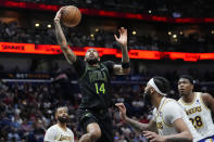 New Orleans Pelicans forward Brandon Ingram (14) goes to the basket in the second half of an NBA basketball game against the Los Angeles Lakers in New Orleans, Sunday, April 14, 2024. The Lakers won 124-108. (AP Photo/Gerald Herbert)