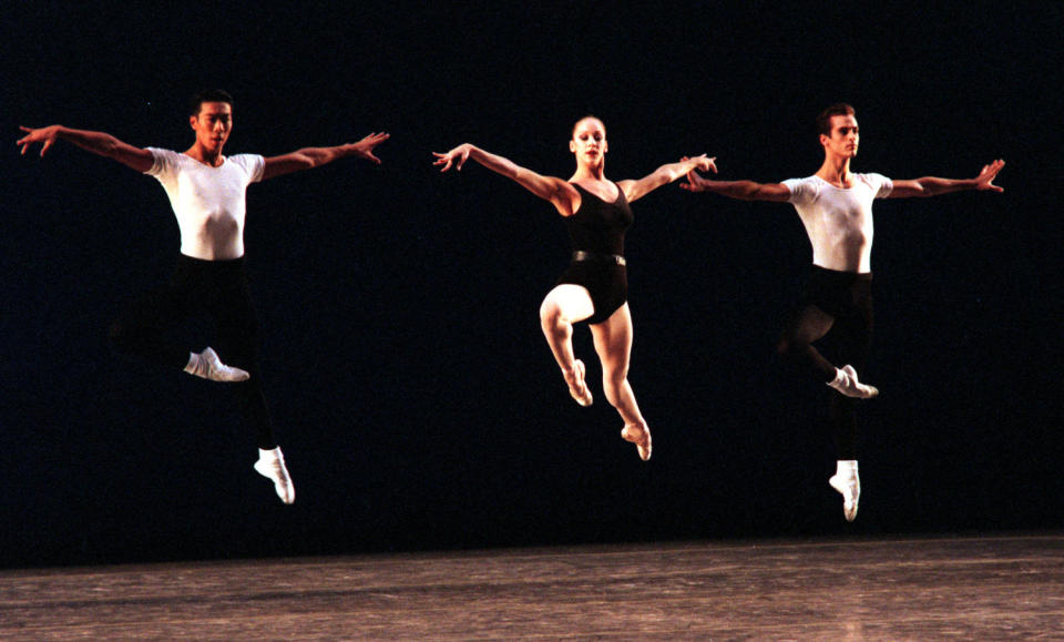 Edward Liang, Maria Kowroski, and Benjamin Millepied of the New York City Ballet leap as they perform the Agon at the Orange County Performing Arts Center in Costa Mesa, California, on 	Oct. 14, 1998. (Richard Hartog / Los Angeles Times via Getty Images)