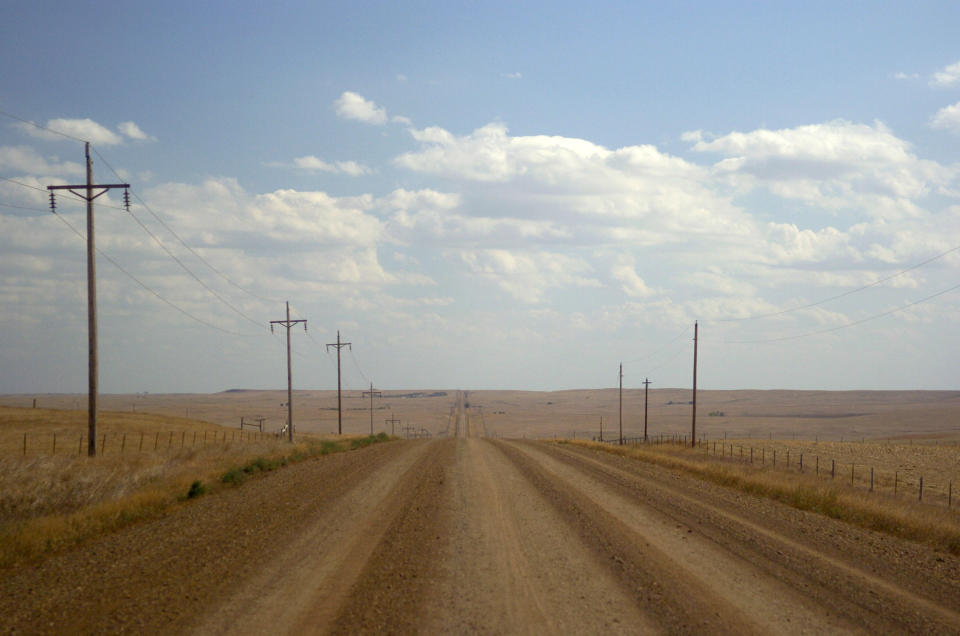 An empty dirt road amid the prairie on the Cheyenne River Reservation near Dupree, S.D.