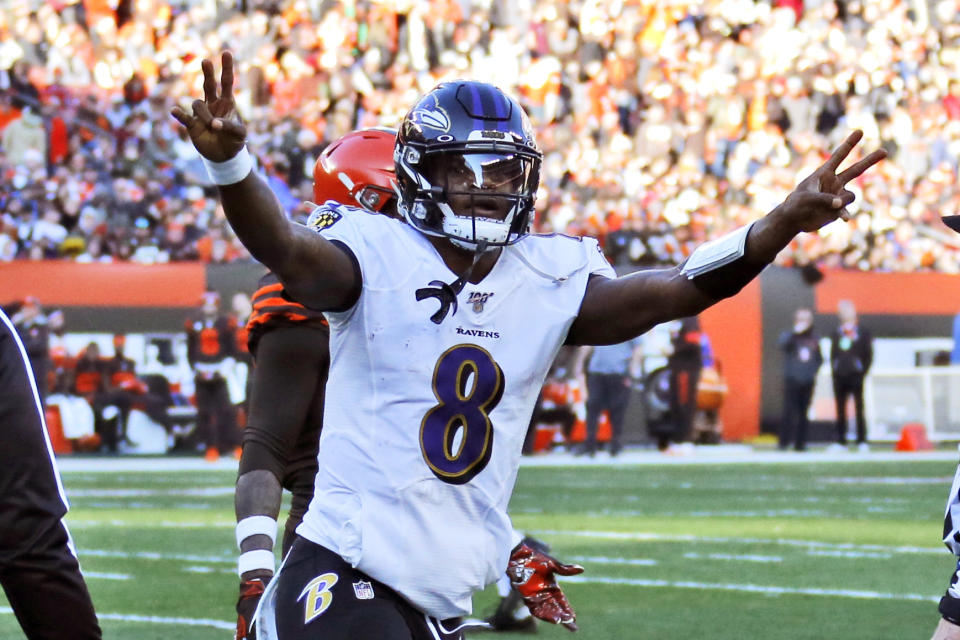 Baltimore Ravens quarterback Lamar Jackson celebrates a 12-yard touchdown pass to running back Mark Ingram during the second half of an NFL football game against the Cleveland Browns, Sunday, Dec. 22, 2019, in Cleveland. (AP Photo/Ron Schwane)