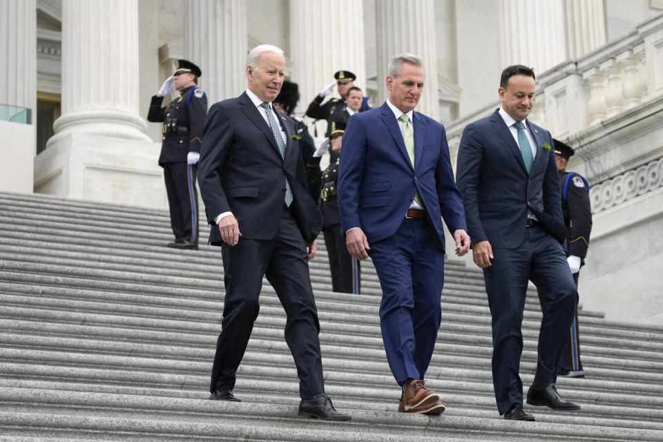 President Joe Biden, House Speaker Kevin McCarthy of Calif., and Ireland's Taoiseach Leo Varadkar walk down the House steps as they leave after attending an annual St. Patrick's Day luncheon gathering at the Capitol in Washington, Friday, March 17, 2023. (AP Photo/Alex Brandon)