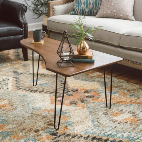 This <a href="https://jet.com/product/Belham-Living-Jacobson-Coffee-Table-with-Hairpin-Legs/748f67285aea459f9b9737a541fafea8" target="_blank">functional&nbsp;shape</a> is perfect for spaces that are a bit awkward and tight.